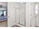Bright bathroom featuring a glass shower with a white shower base and tile flooring at 130 Campaign Dr, Mebane, NC 27302