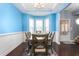 Bright dining room with a bay window and dark hardwood floors at 130 Campaign Dr, Mebane, NC 27302