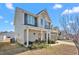 Charming two-story home with covered porch and manicured lawn at 130 Campaign Dr, Mebane, NC 27302
