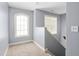 Bright hallway with windows that provide an abundance of natural light for a welcoming atmosphere at 130 Campaign Dr, Mebane, NC 27302