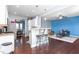 Open kitchen featuring breakfast bar with seating, seamlessly connecting to the adjacent living room and dining area at 130 Campaign Dr, Mebane, NC 27302