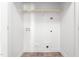 Bright laundry room with white walls, tile floor, and convenient hookups at 130 Campaign Dr, Mebane, NC 27302