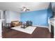 Bright living room with a fireplace, ceiling fan, and hardwood floors at 130 Campaign Dr, Mebane, NC 27302