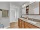 Bathroom featuring a double sink vanity with a granite countertop and ample storage at 130 Hardy Rd, Wendell, NC 27591