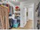 Walk-in closet with custom shelving providing organized storage for clothing and accessories at 130 Hardy Rd, Wendell, NC 27591