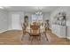 Inviting dining room with wood floors and a chandelier, perfect for Gathering gatherings at 130 Hardy Rd, Wendell, NC 27591