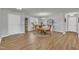 Inviting dining room featuring hardwood floors, natural light and modern chandelier at 130 Hardy Rd, Wendell, NC 27591
