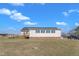 View of the back of the house showing the yard and accessible ramp at 130 Hardy Rd, Wendell, NC 27591