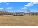 A one-story home on a large lot showcasing its well-maintained exterior and landscape at 130 Hardy Rd, Wendell, NC 27591