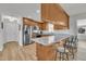 Beautiful kitchen with stainless steel appliances, light countertops, and bar seating at 130 Hardy Rd, Wendell, NC 27591