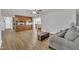 Open concept living room with hardwood floors, kitchen with island, and comfortable seating at 130 Hardy Rd, Wendell, NC 27591
