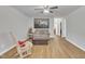 Cozy living room with hardwood floors, featuring neutral paint, comfortable seating, and natural light at 130 Hardy Rd, Wendell, NC 27591