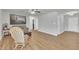 Neutral living room showcasing hardwood floors, rocking chair, and plenty of natural light at 130 Hardy Rd, Wendell, NC 27591