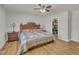 Spacious main bedroom with a ceiling fan and an adjacent walk-in closet for ample storage at 130 Hardy Rd, Wendell, NC 27591