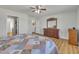 Bright main bedroom featuring multiple closets and warm wood-look flooring at 130 Hardy Rd, Wendell, NC 27591
