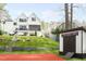View of backyard showing pool, play area, multi-level backyard, and outdoor shed at 1323 Ridge Rd, Raleigh, NC 27607