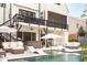 The backyard features a pool, patio, hot tub, outdoor seating, and a multi-story house with balconies at 1323 Ridge Rd, Raleigh, NC 27607