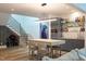 Finished basement with a bar area, modern lighting, and open floor plan at 1323 Ridge Rd, Raleigh, NC 27607