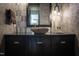 Modern bathroom features a stone sink, pendant light, and neutral color palette at 1323 Ridge Rd, Raleigh, NC 27607