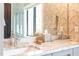 Stylish bathroom with a double vanity, granite counters, and a patterned wallpaper at 1323 Ridge Rd, Raleigh, NC 27607