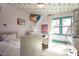 Charming bedroom featuring whimsical wallpaper, twin beds, and ample natural light at 1323 Ridge Rd, Raleigh, NC 27607