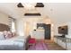 Bright bedroom with king bed, accent lighting, and a TV with built-in shelving at 1323 Ridge Rd, Raleigh, NC 27607