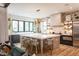 Beautiful kitchen featuring a large island, bar seating, and an open design with lots of natural light at 1323 Ridge Rd, Raleigh, NC 27607