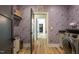 Well-appointed laundry room with modern appliances and beautiful wallpaper at 1323 Ridge Rd, Raleigh, NC 27607