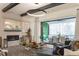 Elegant living area with a fireplace, stylish furnishings, and seamless access to the outdoor patio at 1323 Ridge Rd, Raleigh, NC 27607
