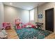 Spacious playroom with colorful decor, hardwood floors, and ample natural light at 1323 Ridge Rd, Raleigh, NC 27607