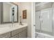 Well-lit bathroom with a glass shower and a single sink vanity at 1327 Gloriosa St, Apex, NC 27523