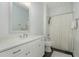 Clean bathroom features white cabinetry, quartz counters, and shower with tub at 1327 Gloriosa St, Apex, NC 27523