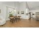 Dining area with hardwood flooring, modern decor, and seamless flow to the open kitchen at 1327 Gloriosa St, Apex, NC 27523