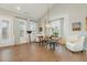 Dining area featuring hardwood flooring and abundant natural light at 1327 Gloriosa St, Apex, NC 27523