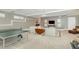 An open-concept living area with a ping pong table, plush sofa and stylish decor at 1327 Gloriosa St, Apex, NC 27523