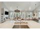 Open-concept living area with hardwood floors and lots of natural light at 1327 Gloriosa St, Apex, NC 27523