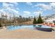Beautiful pool and jacuzzi combination surrounded by brick pavers and landscaping at 1327 Gloriosa St, Apex, NC 27523