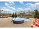Custom pool and spa with surrounding brick patio at 1327 Gloriosa St, Apex, NC 27523