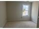 A bedroom has a window allowing natural light to brighten the space at 1448B Maplewood Dr, Durham, NC 27704