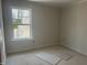 A bedroom space is brightened by a window and awaiting finishing touches at 1448B Maplewood Dr, Durham, NC 27704