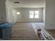 Bright living room featuring a large window, white walls, and natural light at 1448B Maplewood Dr, Durham, NC 27704