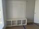 A mudroom bench with cubbies and a decorative paneled back adds style and storage at 1448B Maplewood Dr, Durham, NC 27704