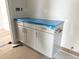 Bathroom featuring a modern cabinet with stainless steel handles, ready for finishing touches at 1448C Maplewood Dr, Durham, NC 27704