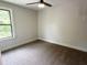 Bedroom with neutral carpet, light walls, and a window with outdoor views at 1448C Maplewood Dr, Durham, NC 27704