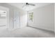 Bright bedroom features neutral paint, carpet, and a window at 1448C Maplewood Dr, Durham, NC 27704