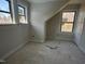 Bedroom with fresh paint, two windows and neutral color palette at 1448C Maplewood Dr, Durham, NC 27704