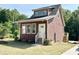 Charming, two-story home with a metal roof, craftsman trim and a neatly manicured lawn at 1448C Maplewood Dr, Durham, NC 27704