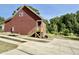 View of side of a home with craftsman trim and a small wooden deck at 1448C Maplewood Dr, Durham, NC 27704