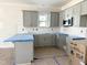 Close-up on a kitchen with gray cabinets, white subway tile backsplash, and modern microwave at 1448C Maplewood Dr, Durham, NC 27704