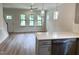 Beautiful kitchen open to living space, featuring quartz counters and stainless appliances at 1448C Maplewood Dr, Durham, NC 27704